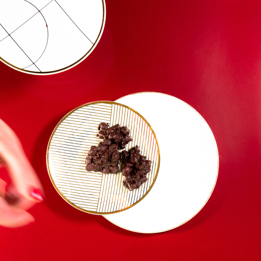 Dark chocolate almond treats with sea salt and speculaas spices on baking paper