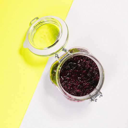 Homemade chia jam made with mixed berries including blueberries, raspberries and strawberries in a glass jar
