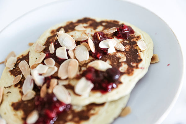 Healthy almond pancakes topped with chia marmalade on a plate