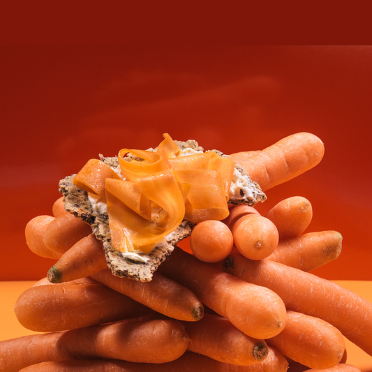 Thin marinated carrot strips resembling smoked salmon, served on toast with dill