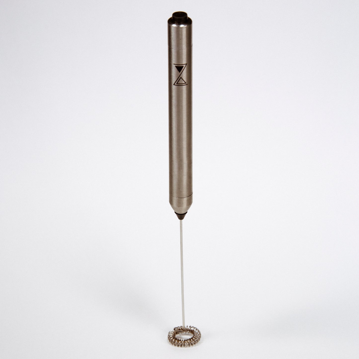 A stainless steel milk frother with a long whisk, featuring a dark-colored handle with the brand 'ZIRTUI logo' on it, against a white background.
